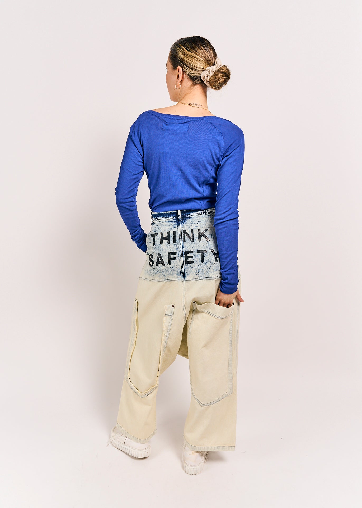 Model wearing Rundholz DIP 2030115-bleachwash trousers back